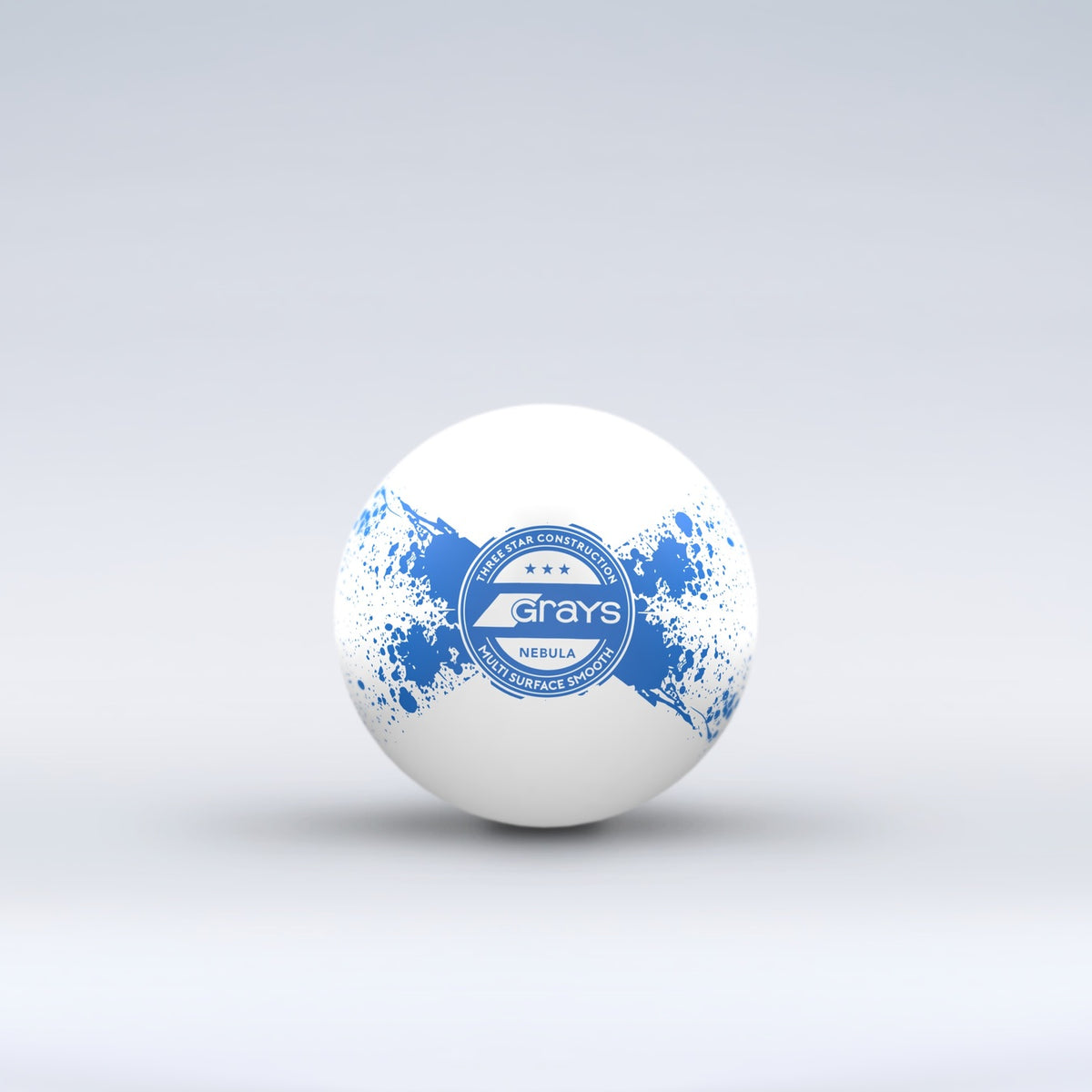 The Grays Novelty Hockey Ball 2026 is a white ball with blue paint splatter, a central circular Grays logo, and durable 3 star construction, shown against a light gray background.