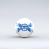 The Grays Novelty Hockey Ball 2026 is a white ball with blue paint splatter, a central circular Grays logo, and durable 3 star construction, shown against a light gray background.