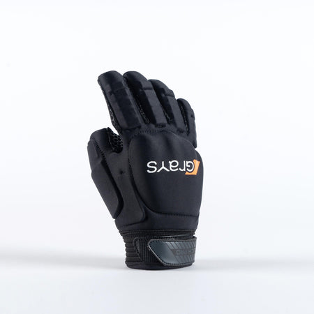 The Grays Touch Pro Hockey Glove in black stands upright on a white surface, featuring padded sections, full finger coverage, knuckle armor, a secure Velcro strap, and the Grays logo in white and orange on the back.