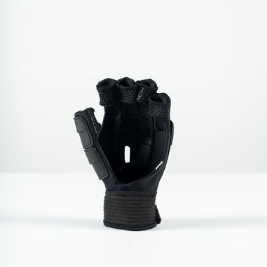 The Grays Prime Touch Hockey Glove by Grays is a black fingerless glove with padded knuckles, FlexShell armour, and a wide wrist strap, shown standing upright on a plain white surface.