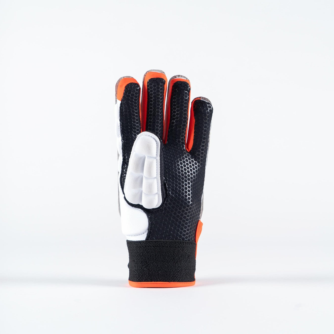The Grays International Pro Hockey Glove by Grays is a black and white, full-finger glove with orange accents. It stands upright on a plain white background and features a lycra palm with textured, padded sections for grip and protection.