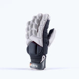 A padded, white Grays Apex Full Hockey Glove with segmented EVA Foam construction stands upright. The wrist strap shows the Grays brand and part of the label.