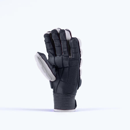 The Grays Apex Full Hockey Glove by Grays is shown upright against a plain background, displaying its full-finger black and white EVA Foam design with the Climagrip Pro Palm visible and the fingers slightly curved.