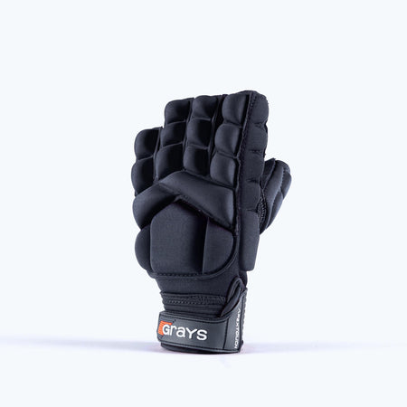 The Grays Apex Touch Hockey Glove is a black, padded half-finger sports glove with finger and knuckle protection, all-weather grip, and a wrist strap featuring the Grays brand name. Shown upright with the palm facing backward.