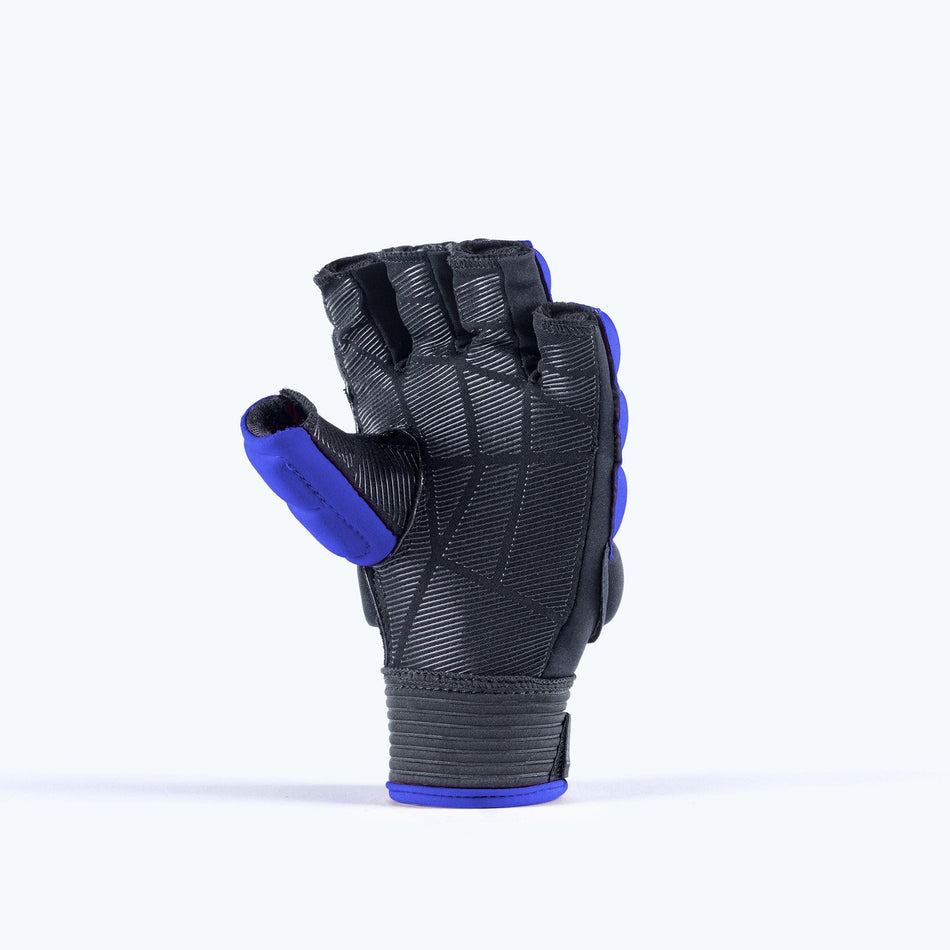 The Grays Apex Touch Hockey Glove by Grays features black EVA foam with a half-finger design and blue trim, standing upright on a plain light background, palm side forward and thumb extended.