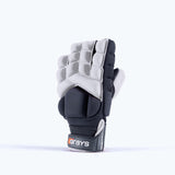 The Grays Apex Touch Hockey Glove is a single white padded sports glove with an all-weather grip and Grays branding on the wrist strap, designed for hand protection during field hockey.