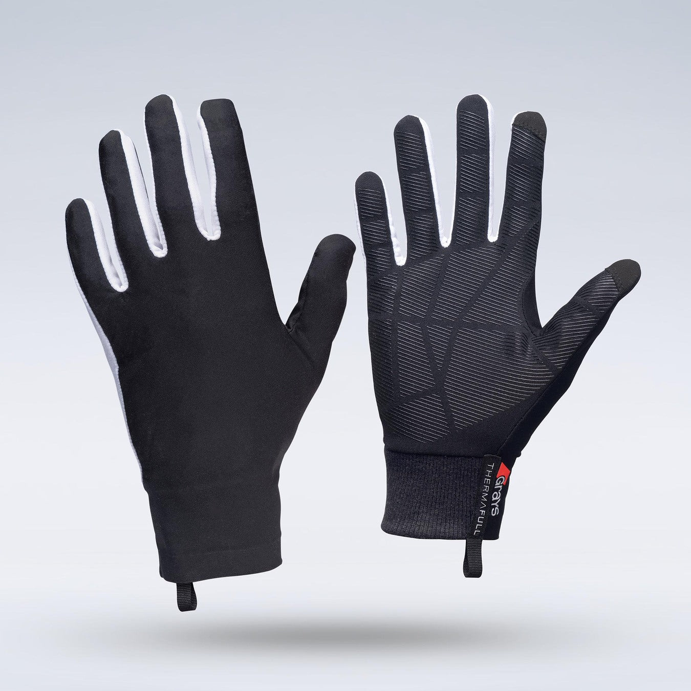Two black Grays Therma Full Hockey Gloves by Grays stand upright on a light gray background, showcasing an all-weather textured grip on the palms, a full-finger design with white details, and pull tabs at the cuffs.