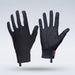 Two black Grays Therma Full Hockey Gloves by Grays stand upright on a light gray background, showcasing an all-weather textured grip on the palms, a full-finger design with white details, and pull tabs at the cuffs.