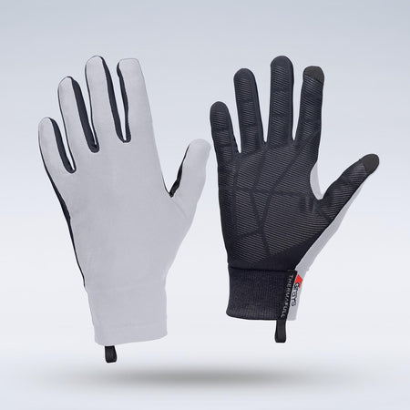A pair of lightweight, ergonomic Grays Therma Full Hockey Gloves by Grays in white, featuring long fingers and a sleek full-finger design—one glove reveals the gray palm while the other displays a black textured all-weather grip and small fabric tag.