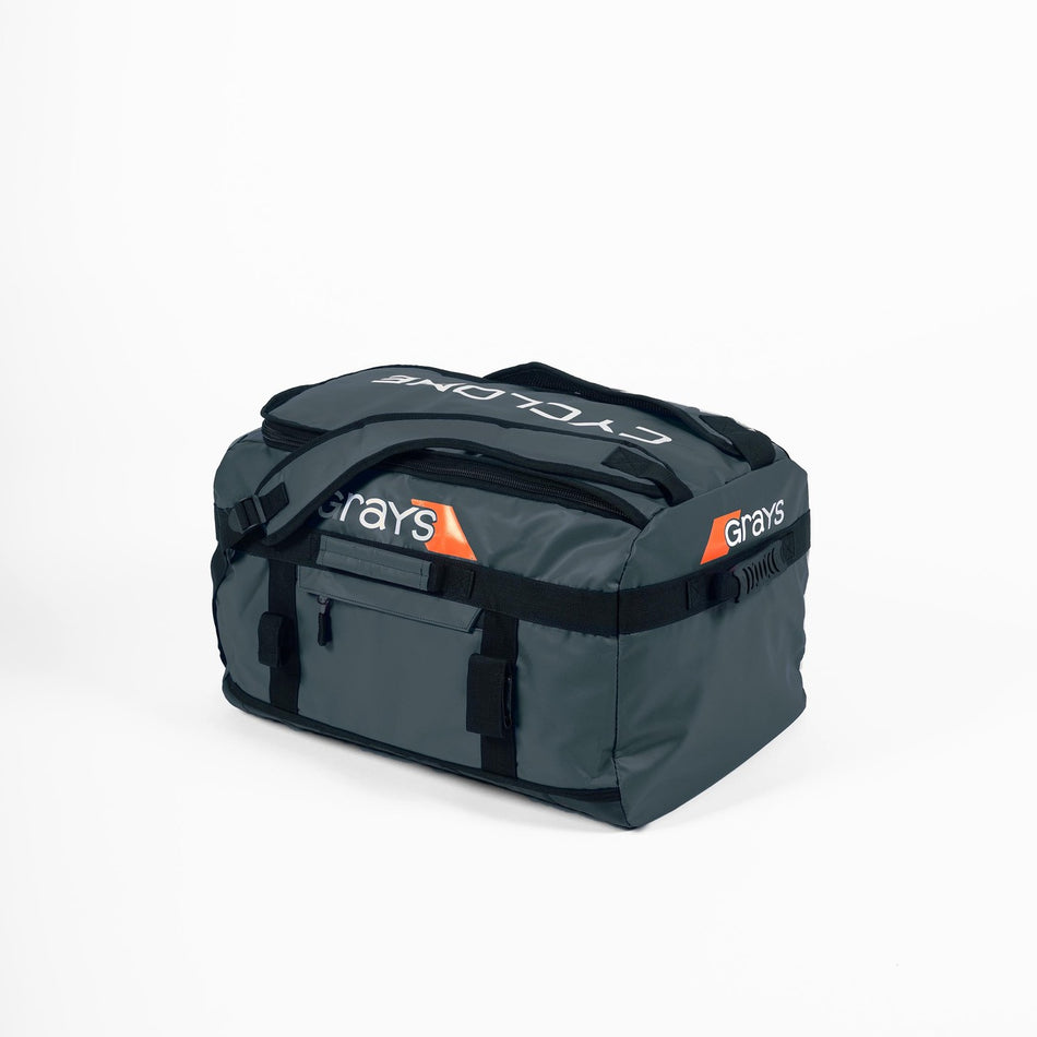 The Grays Cyclone WP Holdall is a large, grey waterproof bag with black straps and handles. Featuring the Grays brand name, an orange accent, and "CYCLONE" on top, the bag is shown against a plain white background.