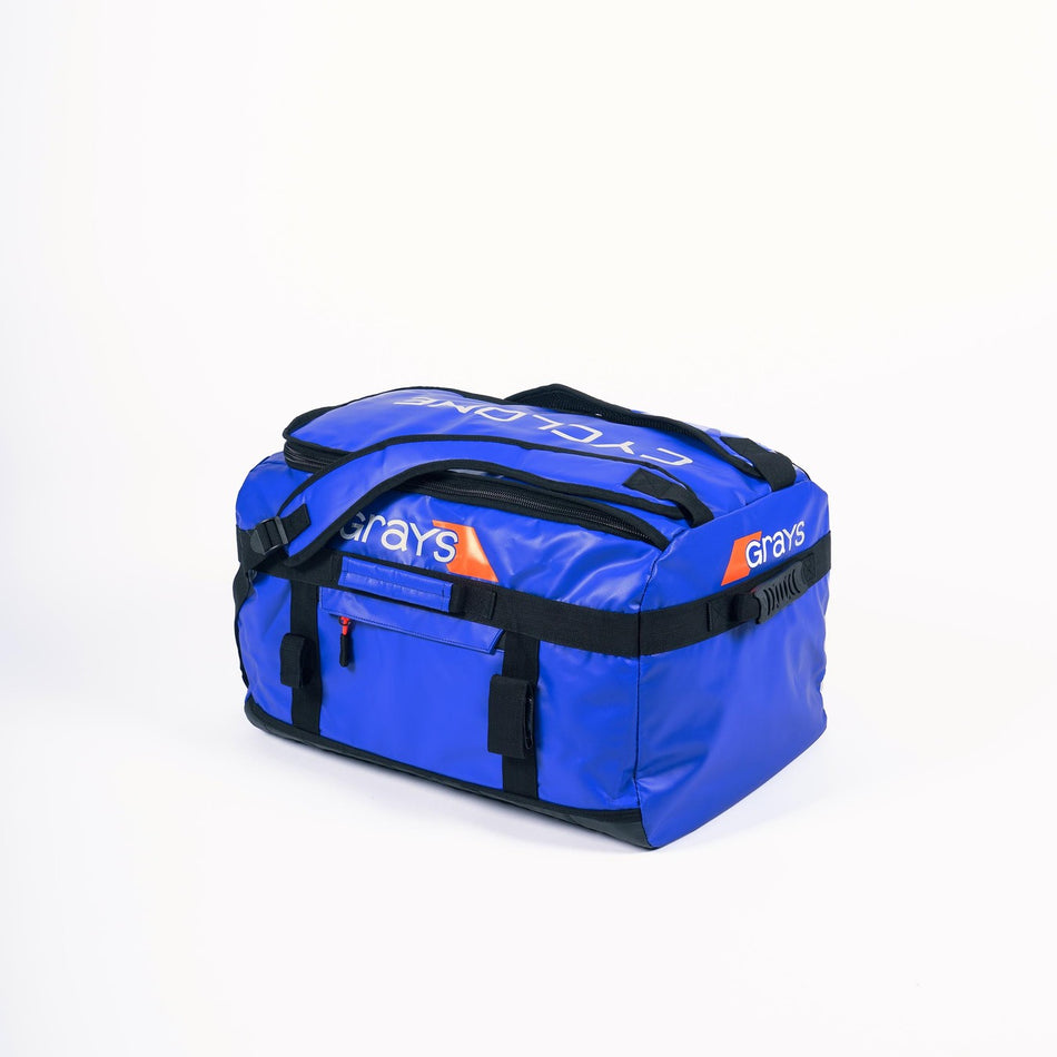 A large blue Grays Cyclone WP Holdall with black straps and handles, featuring "Grays" and "CYCLONE" in white and orange text on the side and top, is displayed against a plain white background.