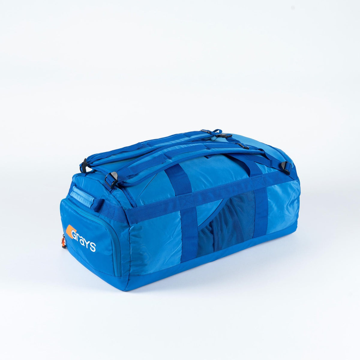 The Grays Omega Gen 4 Holdall is a large blue hockey bag with handles, a shoulder strap, and the Grays logo. Designed for sticks and gear, this Pro Hockey Holdall appears on a plain white background.