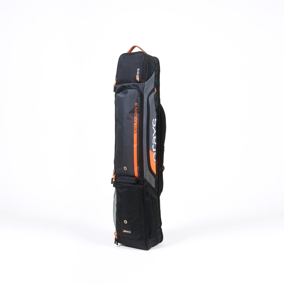The Grays Delta Gen3 Hockey Kitbag by Grays is a black rectangular bag standing upright on a white background, featuring zippered compartments, a padded stick section, shoulder strap, gray accents, and visible Grays branding.