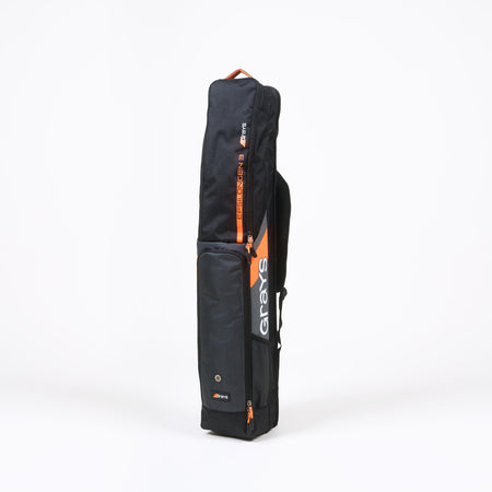The Grays Epsilon Gen 3 Kitbag is a black rectangular bag with orange accents and the Grays logo in white, featuring a padded stick section for hockey sticks, shown upright on a plain white background.