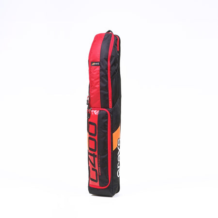 A black and red Grays G400 Hockey Kit Bag stands upright on a white background, featuring water-repellent material, a padded stick compartment, and the GRAYS logo printed on the side.