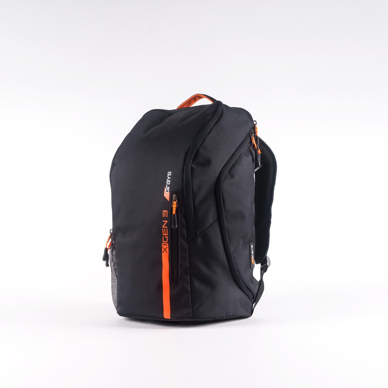 The Grays XI Gen 3 Rucksack by Grays is black with orange zippers and accents, a top handle, mesh side pocket, padded laptop pocket, and XGEN 3 branding on the front, shown against a plain white background.