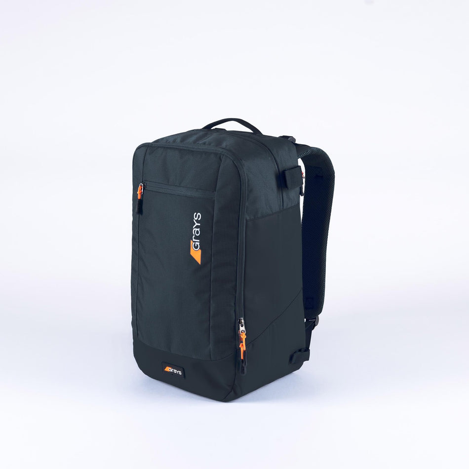 The Grays XI Gen 4 Rucksack, a black sports backpack with orange zipper pulls, front pocket, and top handle, is shown on a plain white background. The Grays logo appears on the front pocket, making it an ideal hockey rucksack.