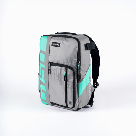 The Grays G150 Rucksack by Grays, in Grey/Aqua, features black accents, multiple zippered compartments, a front logo patch, and a stick harness system—ideal for youth players. The bag is shown upright against a plain white background.
