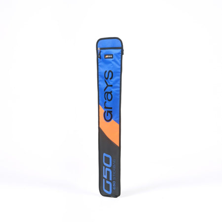 The Grays G50 Stick Bag in blue, black, and orange stands upright against a white background with bold Grays branding, an adjustable strap for comfort, and a top zipper pocket.