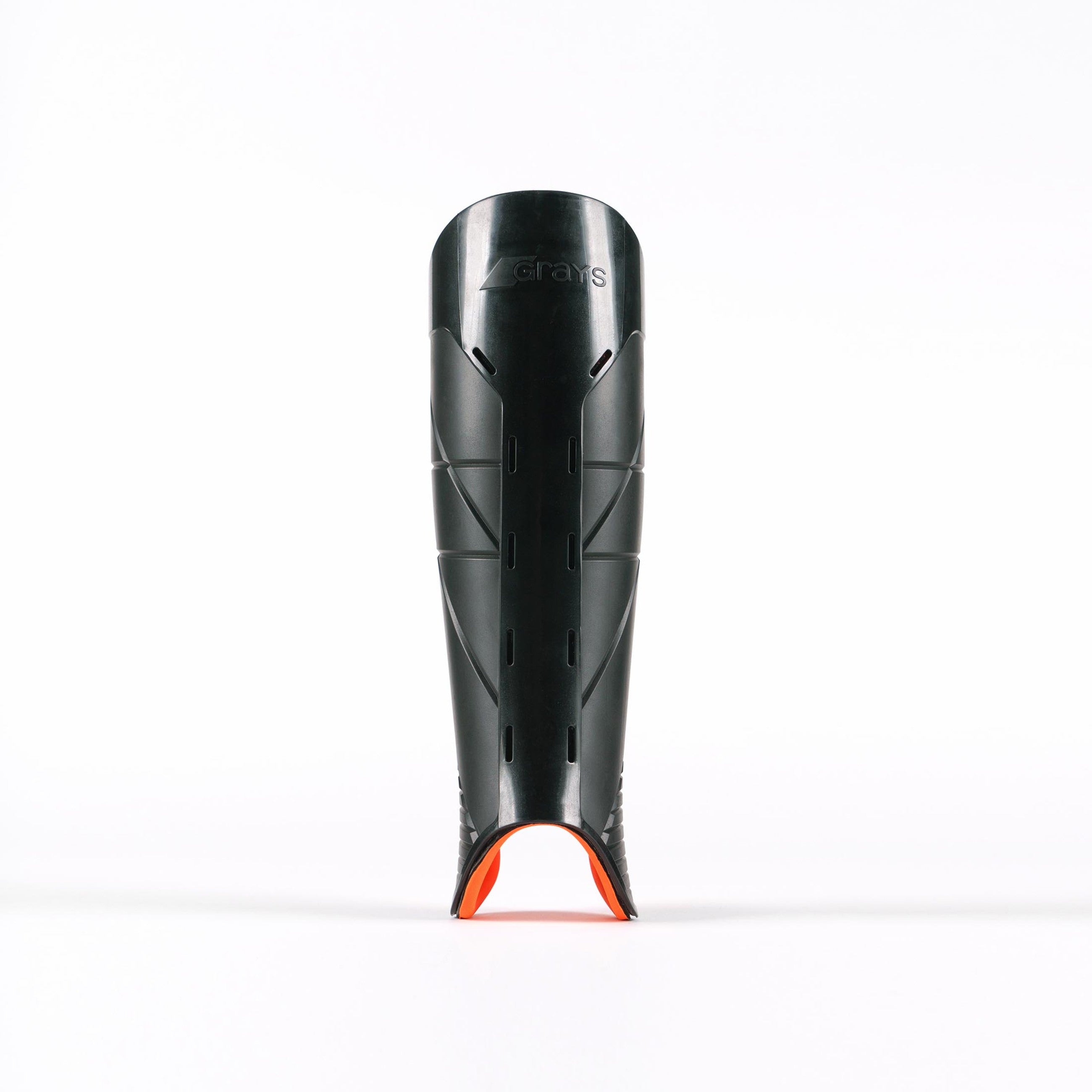 A black Grays Hockey G900 Shinguard with small ventilation slits and an orange accent at the bottom, made from advanced flexible polymer for top protection, stands upright on a white background.