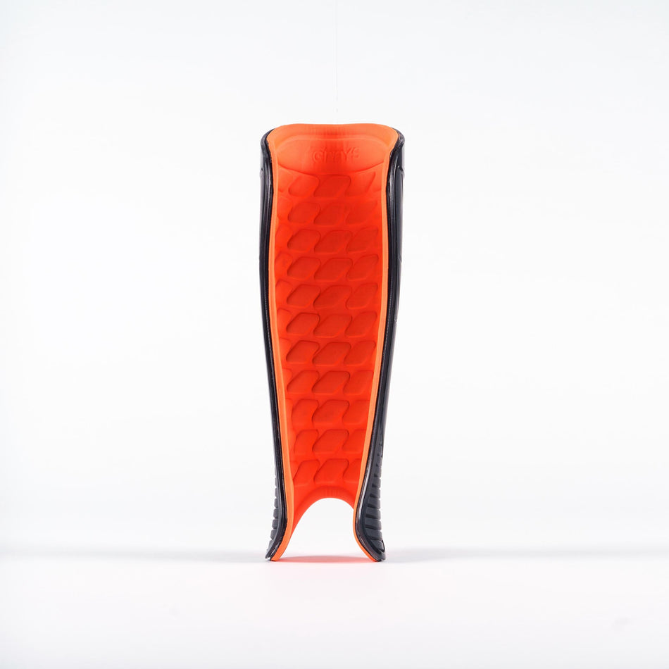The Grays Hockey G900 Shinguard by Grays is pictured upright on a plain white background, showcasing its padded, textured inner surface made with advanced flexible polymer for superior hockey protection.
