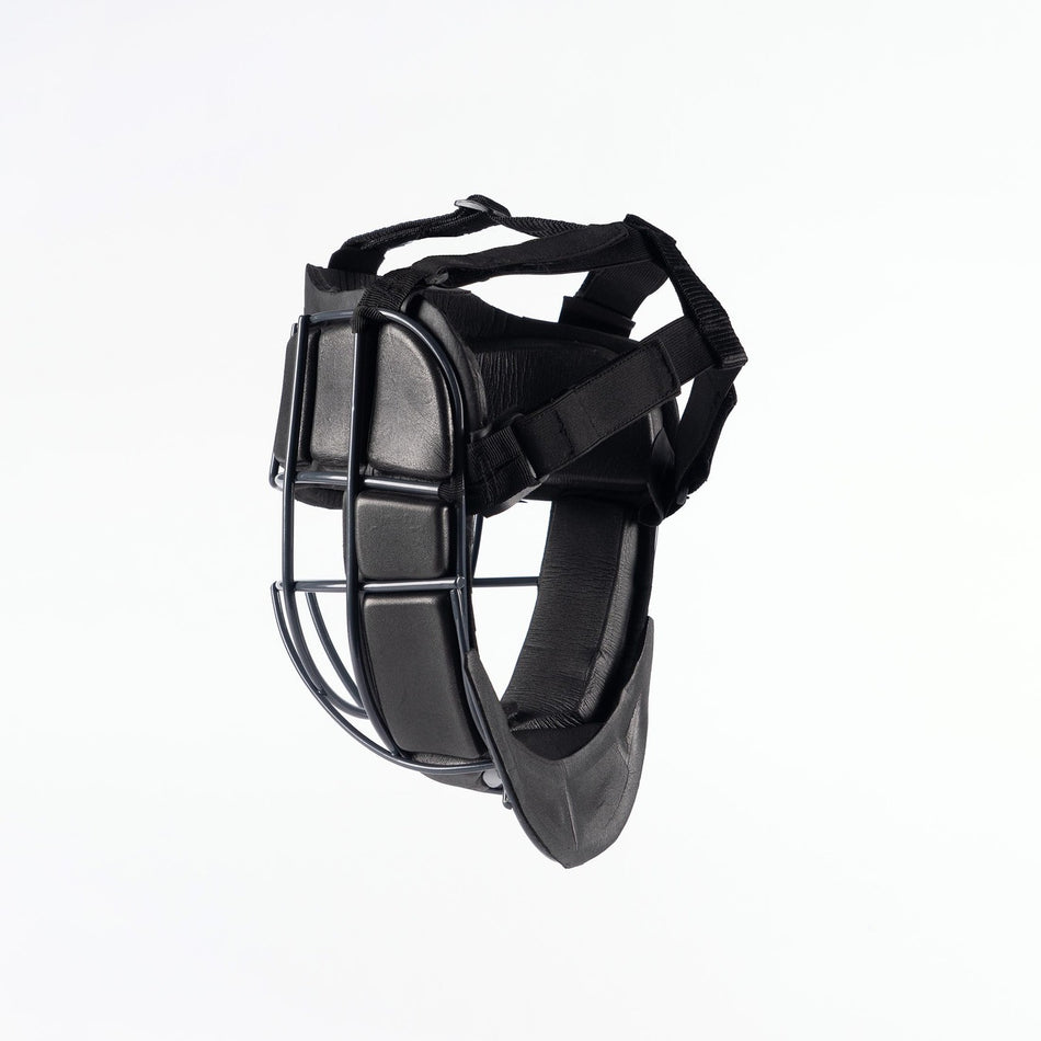 The Grays Elite Facemask by Grays is a black field hockey face guard with padded sections, adjustable nylon straps, and an impact absorption grille, designed for protection during sports, shown on a plain white background.
