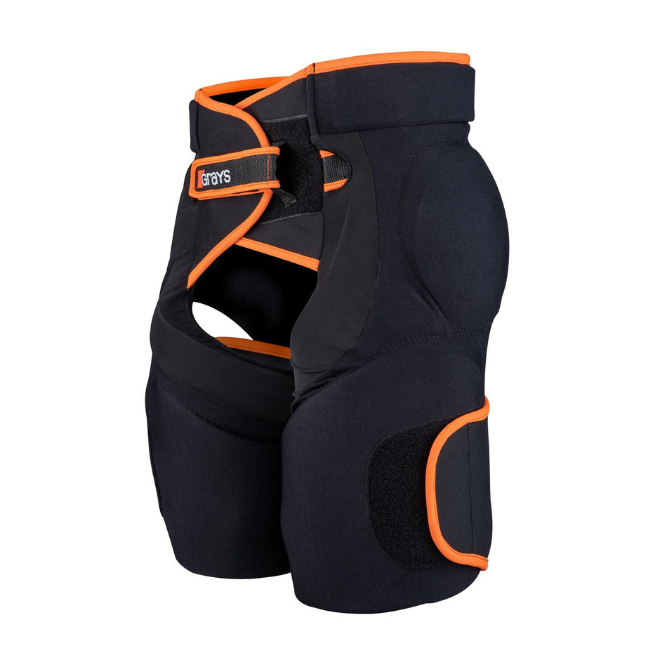 The Grays Elite Padded GK Shorts - Junior by Grays are black shorts with orange trim and Velcro straps, featuring high-density foam for impact protection, ideal for sports use and shown against a white background.