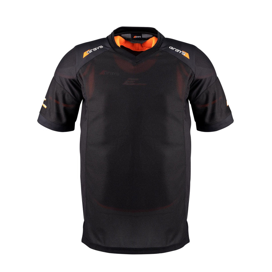 The Grays Elite Pro S/S Smock - Junior is a black short-sleeve jersey with orange shoulder and collar accents, subtle branding on the chest and sleeves, and made from breathable popcorn mesh. Brand: Grays. Color: Black.