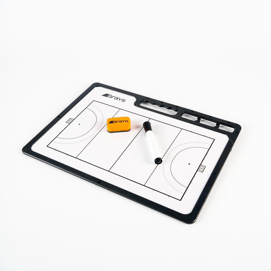 The Grays Hockey Tactic Board by Grays is a reusable surface board displaying a hockey field layout, and comes with a black dry erase marker and small yellow eraser, all shown on a white background.