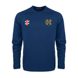 The Gray Nicolls Hawkesbury Upton CC Matrix V2 L/S Training Shirt is a navy athletic top featuring a yellow left chest emblem, red and white right chest logo, round neckline, and moisture-wicking fabric for comfort during workouts.