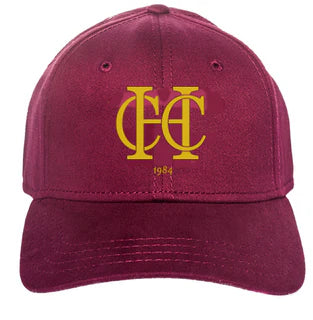 The Martin Berrill Sports Custom Baseball Cap features maroon fabric, yellow overlapping HC logo embroidery, and '1984' on the front—order with no minimum required.