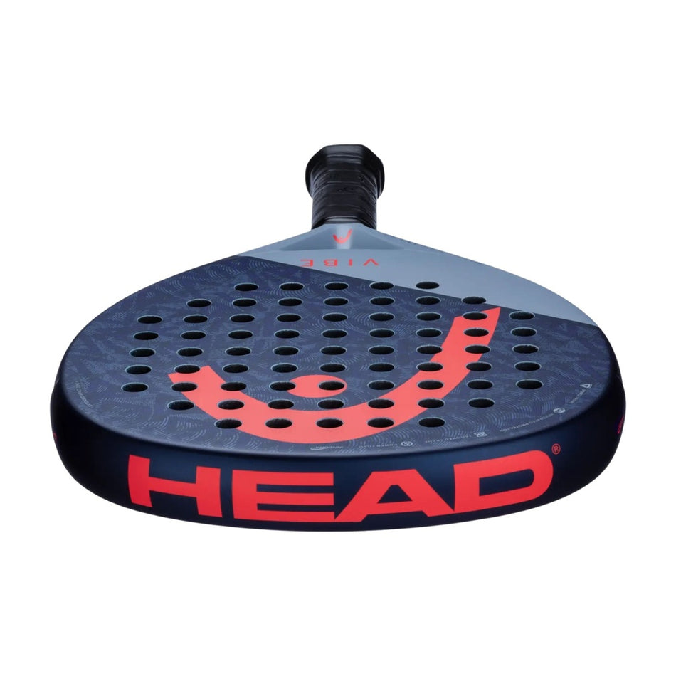 A close-up of the Head Vibe Padel Racket highlights its perforated surface, large red HEAD logo on the edge, and a dark and light gray design that expands the sweet spot.