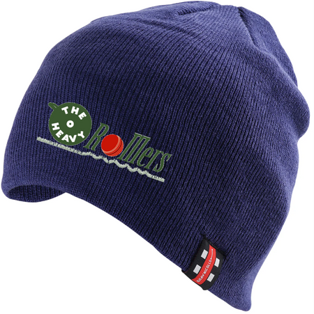 The Gray Nicolls Heavy Rollers CC Beanie Hat is navy blue, made from 100% acrylic stretch fabric, and features The Heavy Rollers logo with a green bowling ball and red pin on the front, plus a black-and-red tag on the brim.