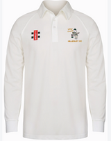 The Gray Nicolls Hillesley CC Matrix V2 Long Sleeve Match Shirt is white with a collar, features moisture-wicking fabric, a red and black logo on the right chest, and the Hillesley CC crest with player graphic and text on the left.