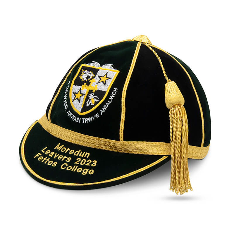 The Martin Berrill Sports Custom, Honour & Commemorative Cap features black and gold design, a gold tassel, crest embroidery, and "Moredun Leavers 2023 Fettes College"—ideal for honour caps or unique cricket souvenirs.