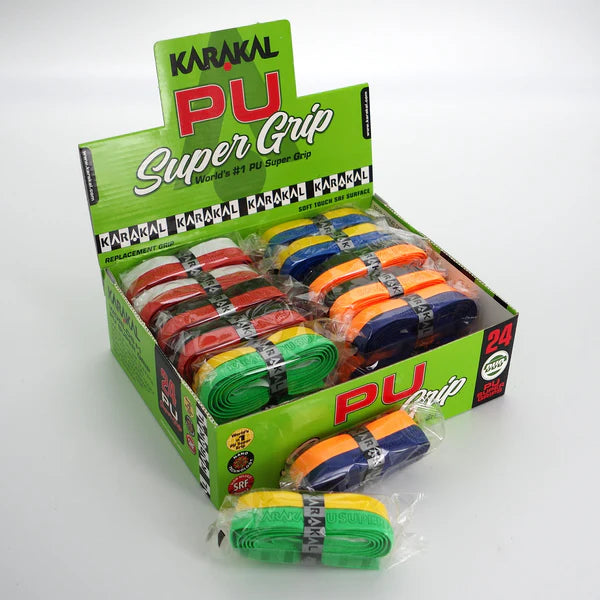 The Karakal PU Super Grip - Duo Box of 24 Assorted by Karakal includes 24 individually wrapped grips in green, orange, blue, yellow, and red. The box highlights “Soft Feel,” ideal for any racket sport.