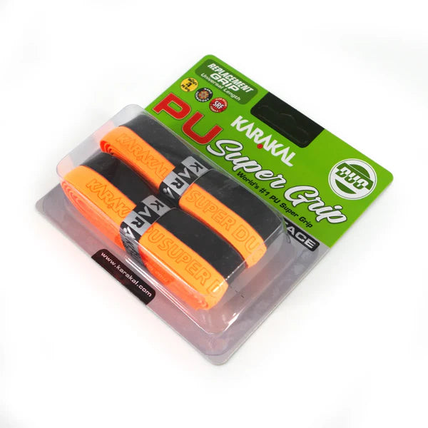 The Karakal PU Super Grip Duo - Pack of Two features black and orange overgrips for rackets, shown in clear packaging with green and black Karakal branding. Ideal as a comfortable replacement grip for any racket sport.