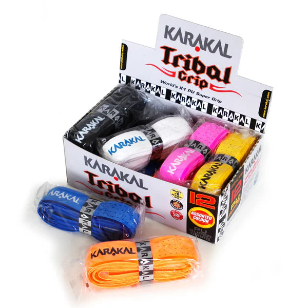 The Karakal PU Super Tribal Grip Box of 12 features racket grips in assorted colors like black, white, pink, yellow, orange, and blue. Three super absorbent Karakal grips are shown in their packaging in front of the box.