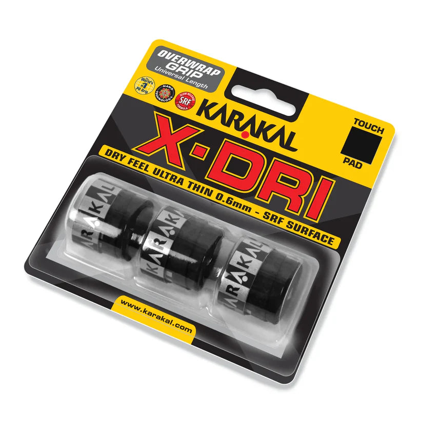 The Karakal X-DRI Overwrap Grip by Karakal comes in black, sold as a pack of three with an ultra-thin 0.6mm dry feel and SRF surface, displayed in clear packaging labeled “Dry Feel Ultra Thin 0.6mm - SRF Surface.”.