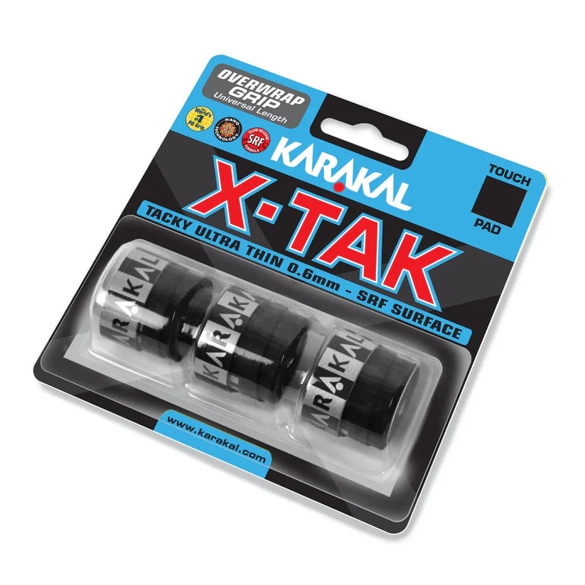 A retail pack of Karakal X-TAK Overwrap Grip by Karakal includes three ultra-thin, tacky black grips for sports equipment in a clear plastic case with blue and black labeling.