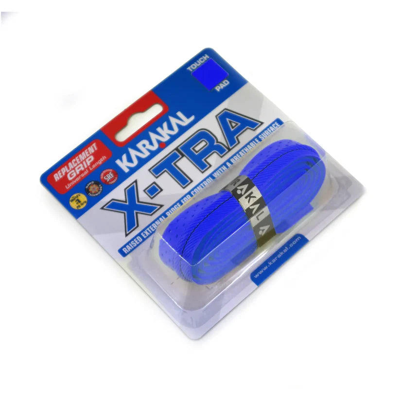 The Karakal X-TRA Grip in blue offers cushioned comfort and bold branding, featuring high-tack handling for extra grip. It comes in a clear plastic and card pack labeled Touch and Pad.