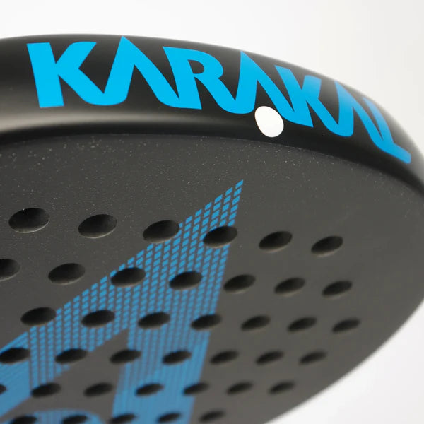Close-up of the Karakal Air Lite 345 Padel - Blue by Karakal, showcasing its black and blue geometric design, bold KARAKAL lettering, lightweight graphite construction, and multiple round holes for enhanced play.