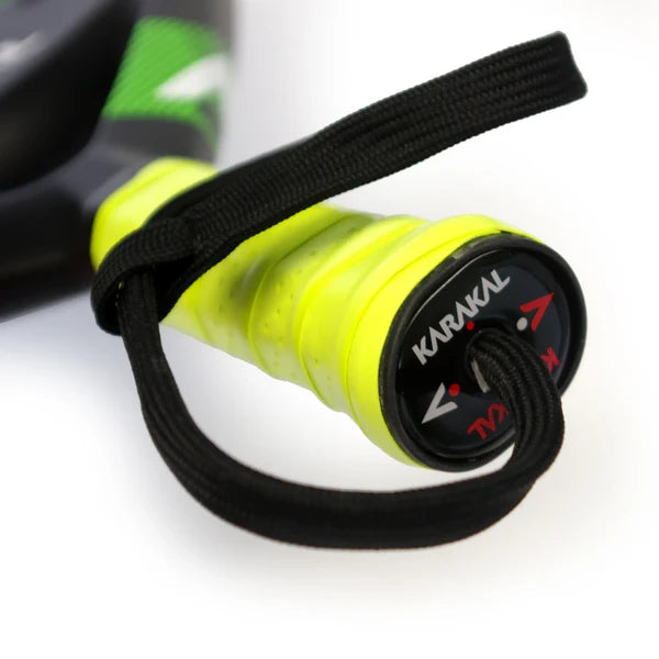 Close-up of the Karakal Air Lite 345 Padel - Green handle with a bright yellow grip, black wrist strap, and KARAKAL branding on the end cap—crafted from lightweight graphite for superior performance.