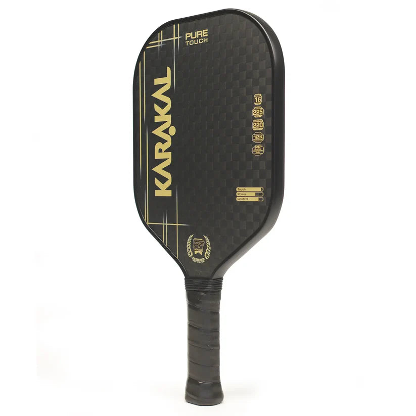 The Karakal Pure Touch Gold Pickleball Paddle is black with gold graphics, features a power core and textured surface for better play, and has a wrapped handle plus vertical brand name and specs displayed on the front.
