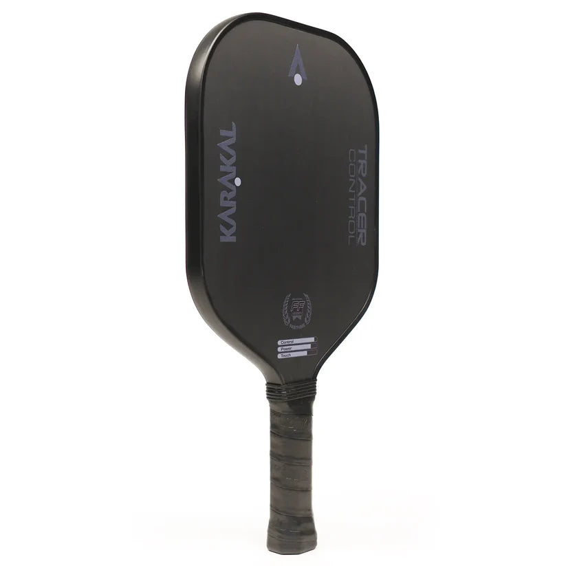 The Karakal Tracer Control Pickleball Paddle features a black finish, honeycomb power core, textured grip, vertical Karakal branding, and a sleek minimalist design with both face and handle prominently visible.