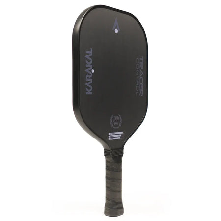 The Karakal Tracer Control Pickleball Paddle features a black finish, honeycomb power core, textured grip, vertical Karakal branding, and a sleek minimalist design with both face and handle prominently visible.