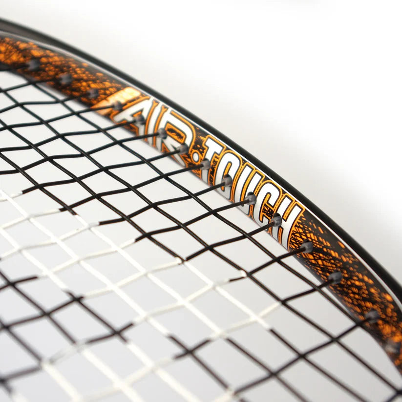 Close-up of the Karakal Air Touch 2.1 Squash Racket, highlighting its lightweight frame, strings, and bold AIR TOUCH branding in orange and white.