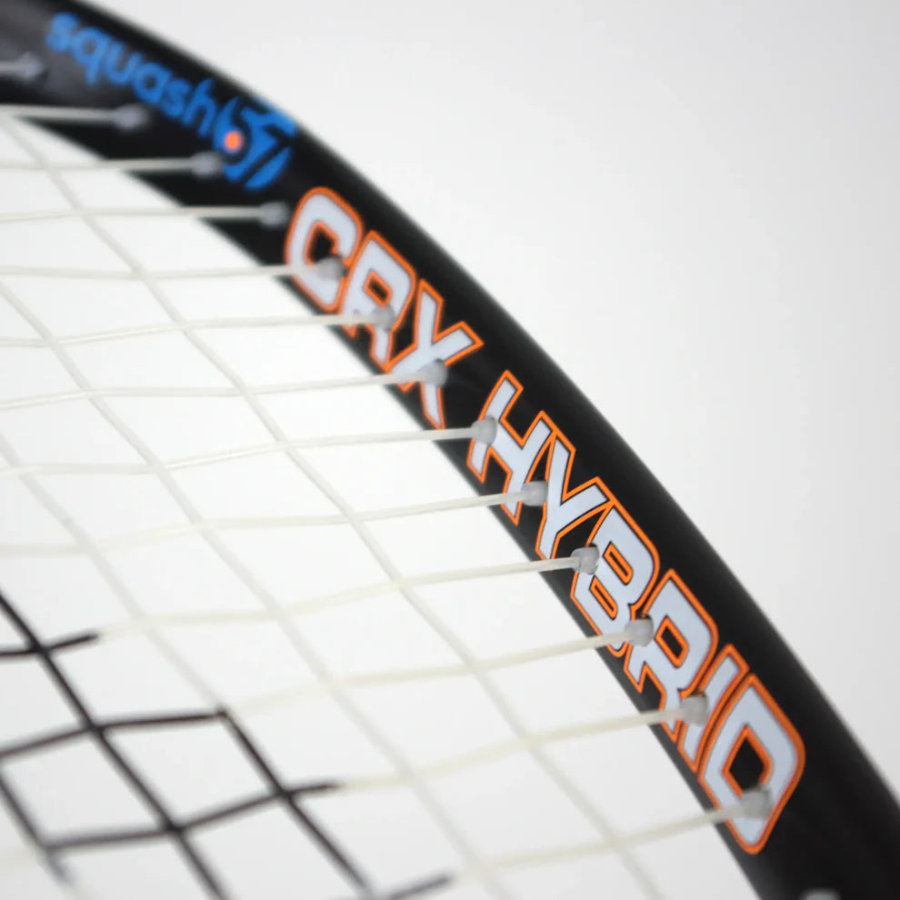 Close-up of the Karakal CRX-Hybrid 2.1 Racketball Racket, a lightweight graphite composite by Karakal featuring white strings, "CRX HYBRID" in orange and white on the midplus frame, and a blue-orange squash logo on the upper part.