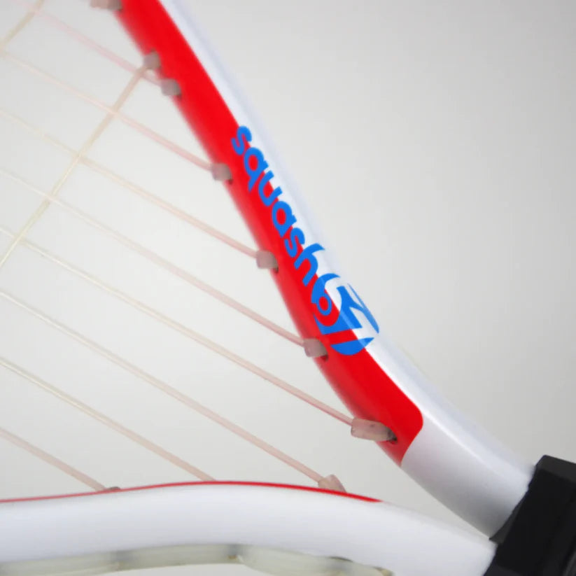 Close-up of the Karakal CRX-Tour 2.1 Racketball Racket, featuring a white and red frame with 7050 alloy construction. The Karakal brand name and an abstract blue logo appear on the side of the midplus head.