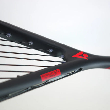 Close-up of the Karakal Air Power 2.1 Squash Racket by Karakal, showing its black high modulus graphite frame with red accents, black strings, visible string holes, and a red label against a plain light background.